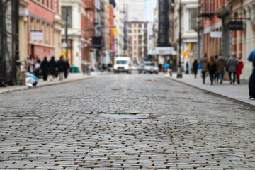Greene Street is crowded with busy people in the SoHo neighborhood of Manhattan, New York City