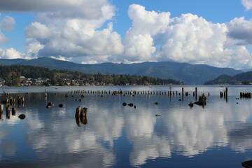 Reflection of the sky and clouds on the calm water of Lake Whatcom in fall