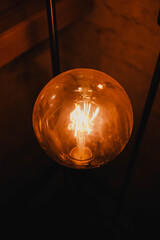 light bulb on the wall. light and shadow. architecture template, orange lamp, warm light