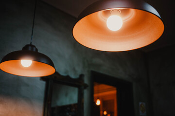 lamp on the ceiling.
Set of light fixtures with warm light, at the back of the room with orange light. Decoration template