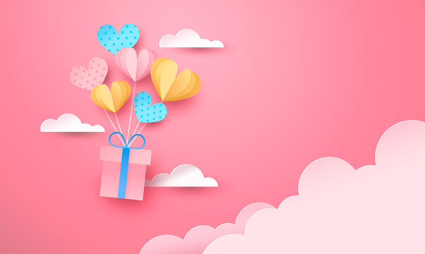 Pink paper gift box flying in sky heart balloon