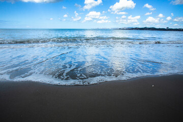 Fototapeta na wymiar Beautiful black sand beach and ocean at shoreline seen from Puerto Rico