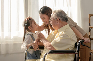 Asian Senior man was sick and sitting on wheelchair. Retirement age lifestyle and togetherness with...