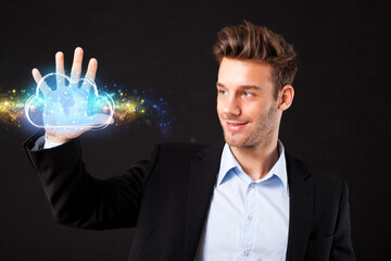 businessman presenting a virtual cloud with a world map in front of black background