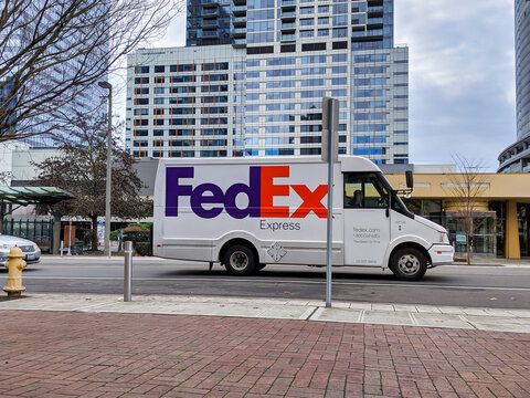 Bellevue, WA / USA - Circa December 2019: Street View Of An Empty FedEx Mail Delivery Truck Parked By The Curb In Downtown Bellevue.