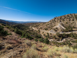 Fototapeta na wymiar Wide angle view of California Mountain Landscape with Winding Road Daytime