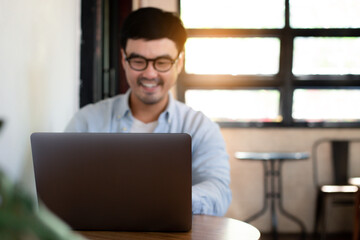 asian man work using computer hand typing laptop keyboard contact us.student study learning education online.adult professional people chatting search at office.concept for technology device business.