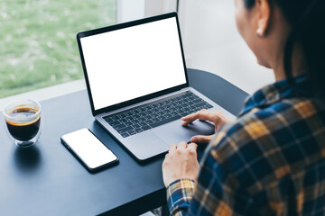 computer screen,cell phone blank mockup.hand woman work using laptop texting mobile.with white...