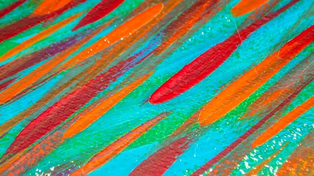 Many different colored lines painted bright paint on canvas close-up. Green, orange, red, blue colors. Brush strokes on canva. Cracks, scratches. Abstract grunge multicolored creativity art background
