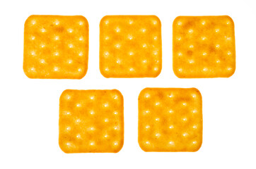 Delicious golden salt cracker cookies isolated on white background.