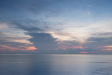 The atmosphere of the sea is calm and beautiful in the morning when the sun rises, making it look like heaven.