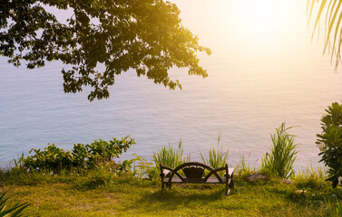 A chair at the viewpoint on the hill overlooking the sea as calm and beautiful as heaven.