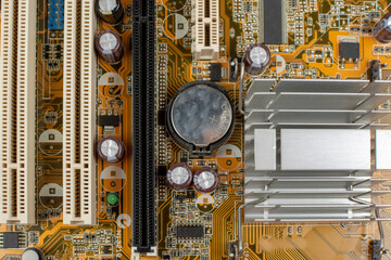 printed motherboard with electronic components close up