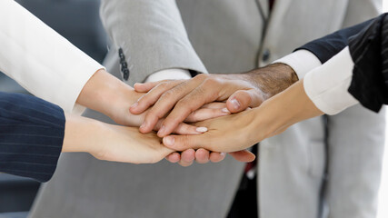 Group of business people stack hands  together, idea for unity and team work.