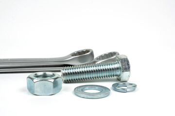 bolts and nuts in silver metal on white background