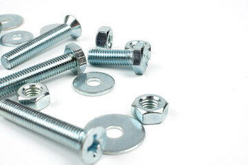 bolts and nuts in silver metal on white background
