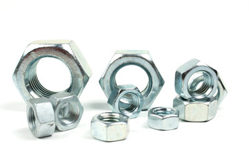 large metal nuts on a white background close up