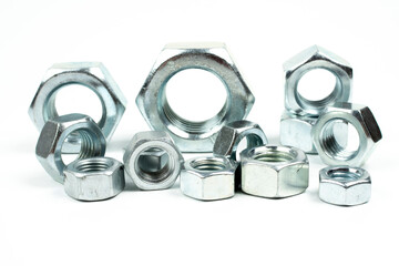 large metal nuts on a white background close up