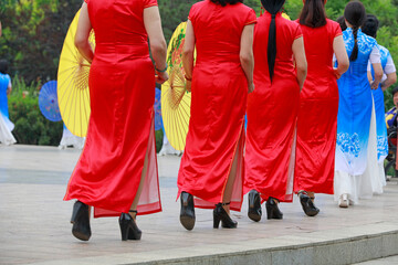 Women in cheongsam perform in the park, LUANNAN COUNTY, Hebei Province, China