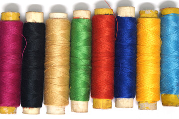 Group of threads in a white background