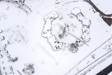 building site covered by snow. aerial top view in winter. construction background