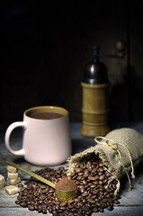 coffee beans and grinder, cup of coffee