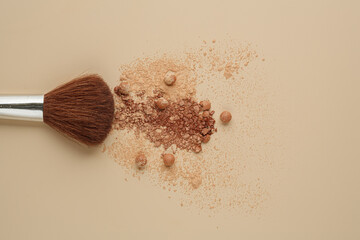 close up of a make up powder and make up brush on a pastel background