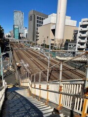 looking down to a stairway from a bride over railway in Shibuya, Tokyo, Japan 