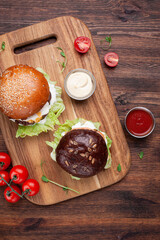 Burger with sauce on wooden desk top