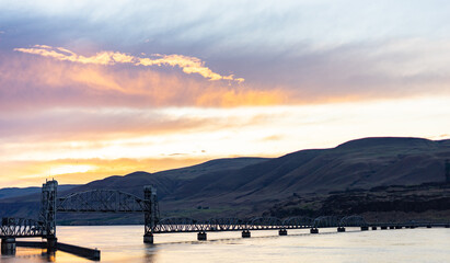 Columbia River bridge spanning the state border between Washington and Oregon, with the bridge section raised.