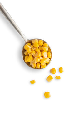 corn in spoon isolated on white background top view
