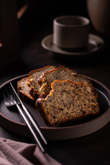 Slices of freshly baked banana bread on a ceramic plate