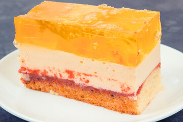 Creamy fruit cake with jelly for different occasions. Festive dessert