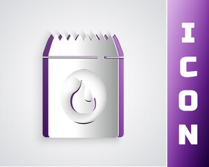 Paper cut Barbecue coal bag icon isolated on black on purple background. Paper art style. Vector.