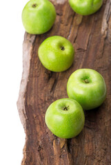 fresh season green apples on vintage wooden background