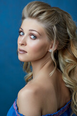 Fototapeta premium Close-up portrait of caucasian young woman with beautiful blue eyes