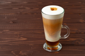 Cup of hot coffee latte on table