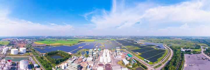 Panorama Aerial view, Solar plant rows array of ground mount system Installation. Crude oil tanker...