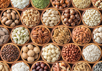 various nuts background, raw food in bowls, top view