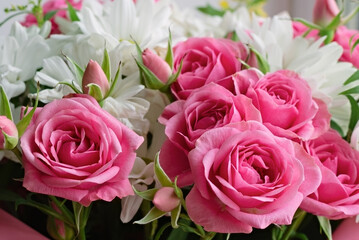Bouquet of pink roses and white chrysanthemums. Flower background