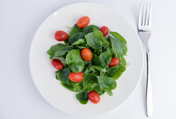 Healthy salad, Fresh watercress and cherry tomatoes. food background