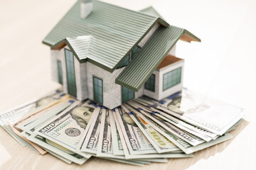 the layout of the house is on a pile of money