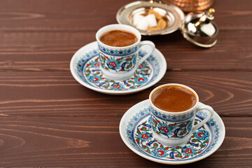 Traditional turkish coffee in oriental dishware close up