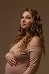 Naklejka premium Pregnant girl on a light background