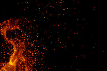 Fototapeta na wymiar flame of fire with games on a black background