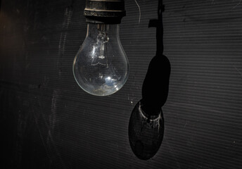 close up of light bulb on black background
