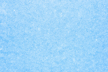 Fototapeta na wymiar Frost on frozen glass. Abstract winter background in blue.