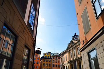 Fototapeta premium Narrow street with colorful buildings in the Old Town (Gamla Stan), Stockholm center, Sweden