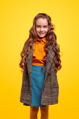 Cheerful schoolgirl in warm coat