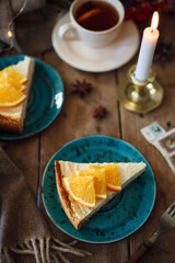 slice of New York cheesecake with orange slices